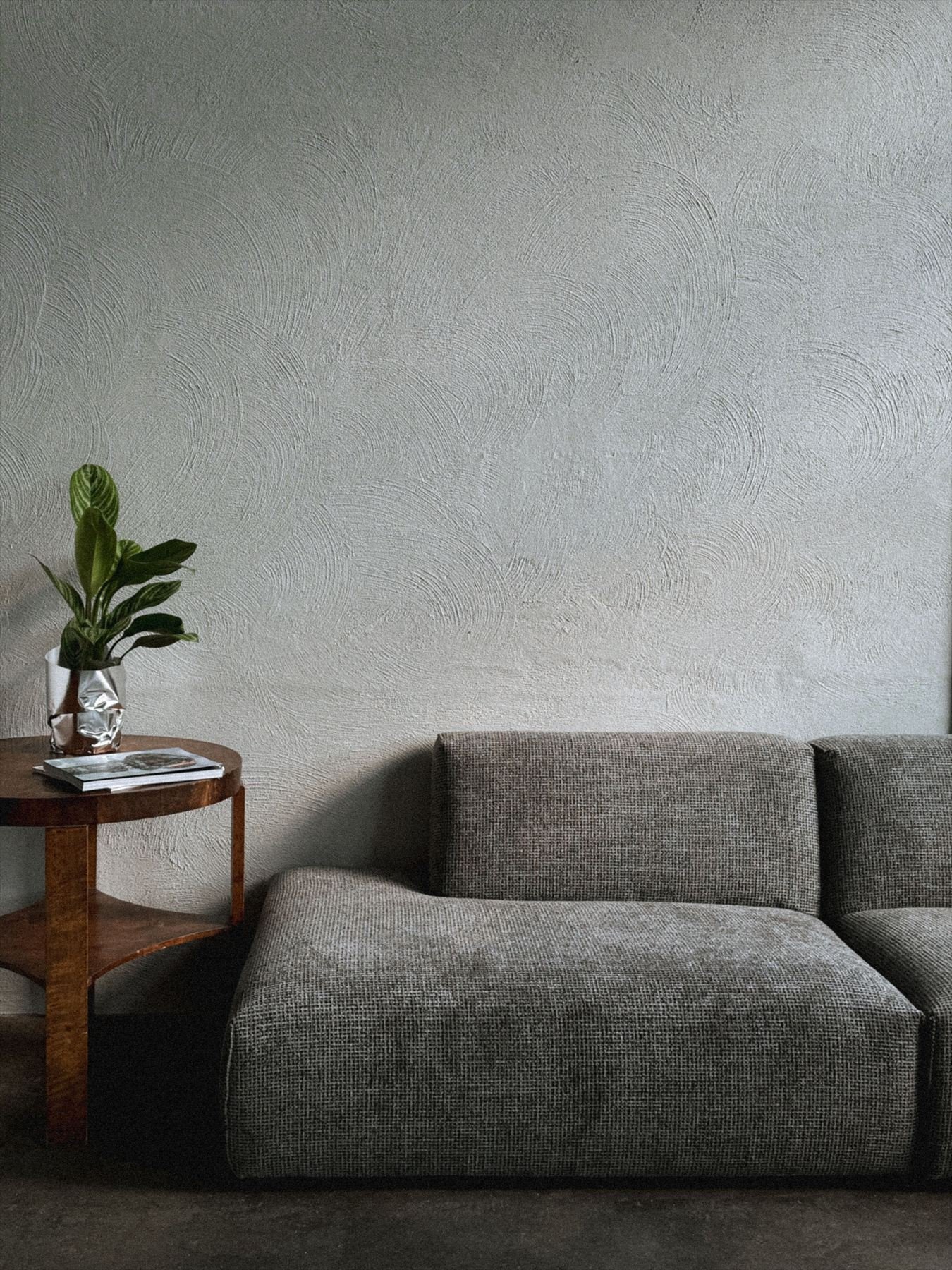 Ash grey polished plaster wall in a modern lounge
