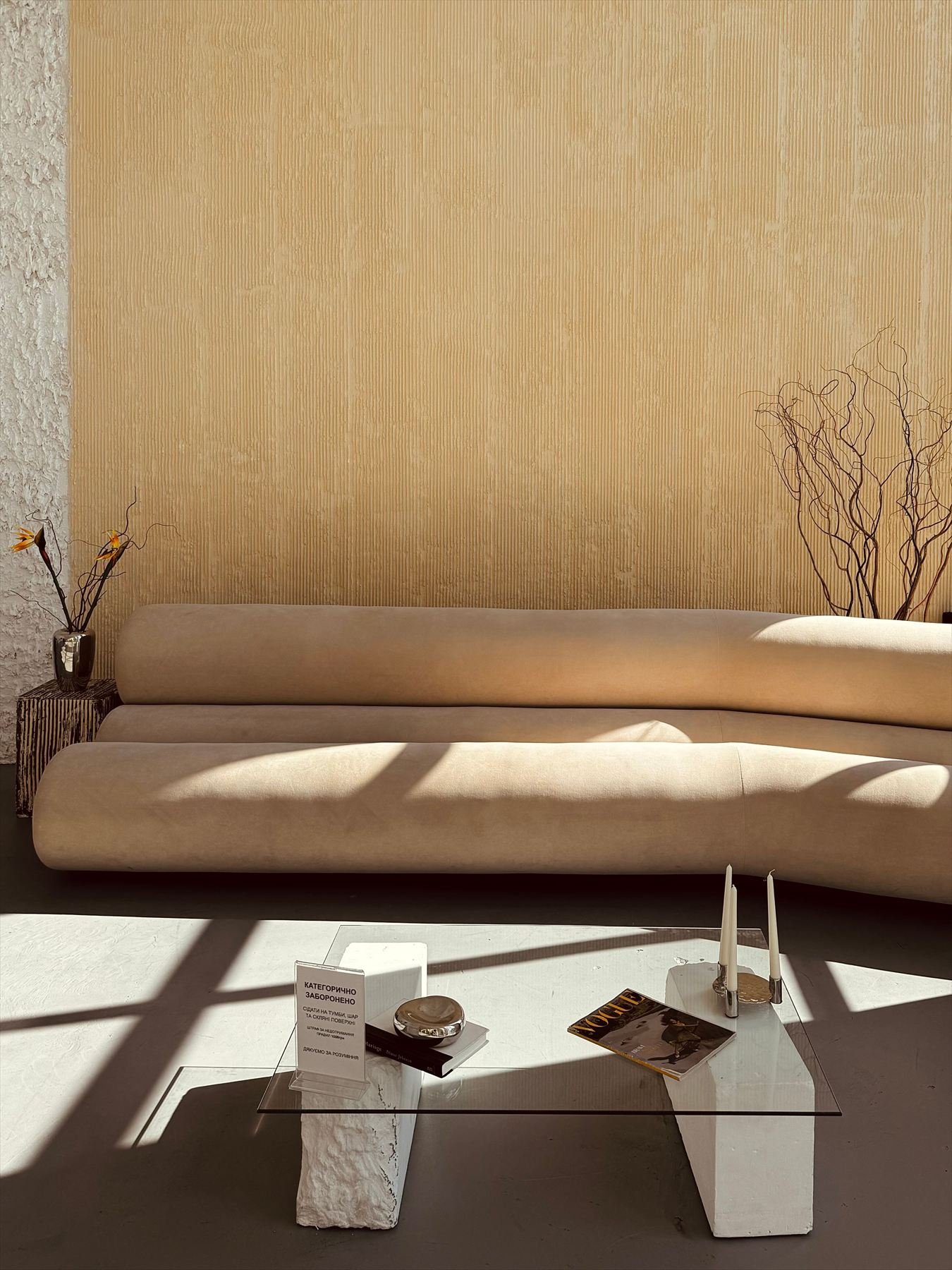 Sand toned plaster wall in a sunlit living room
