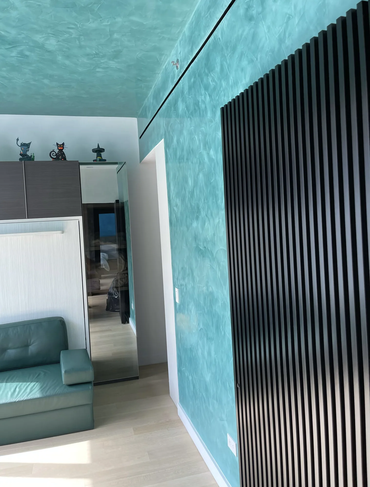 Mineral teal plaster wall in a contemporary interior