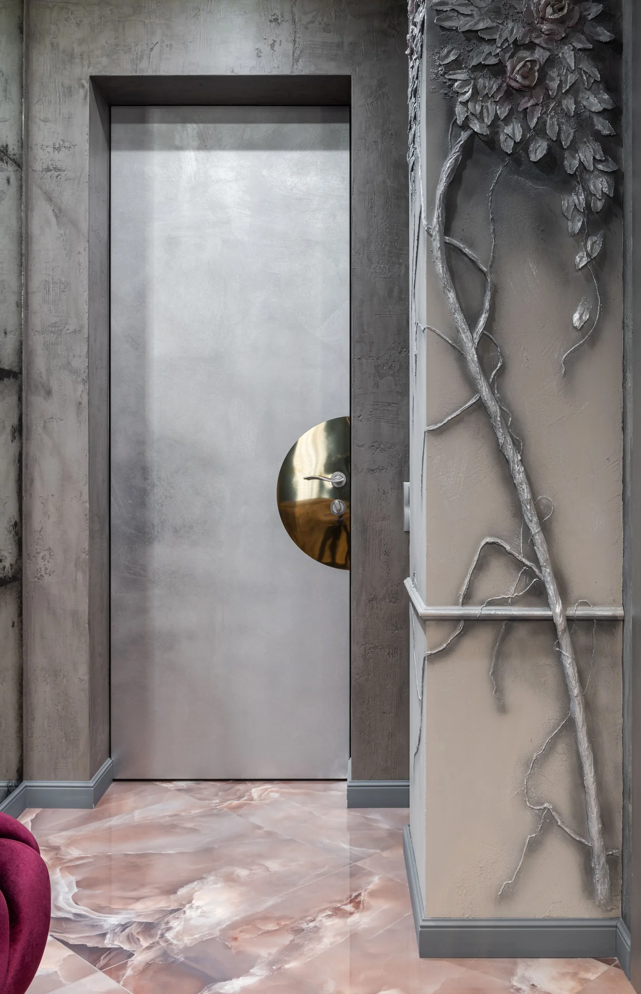 Stone grey architectural finish with sculptural metal branches