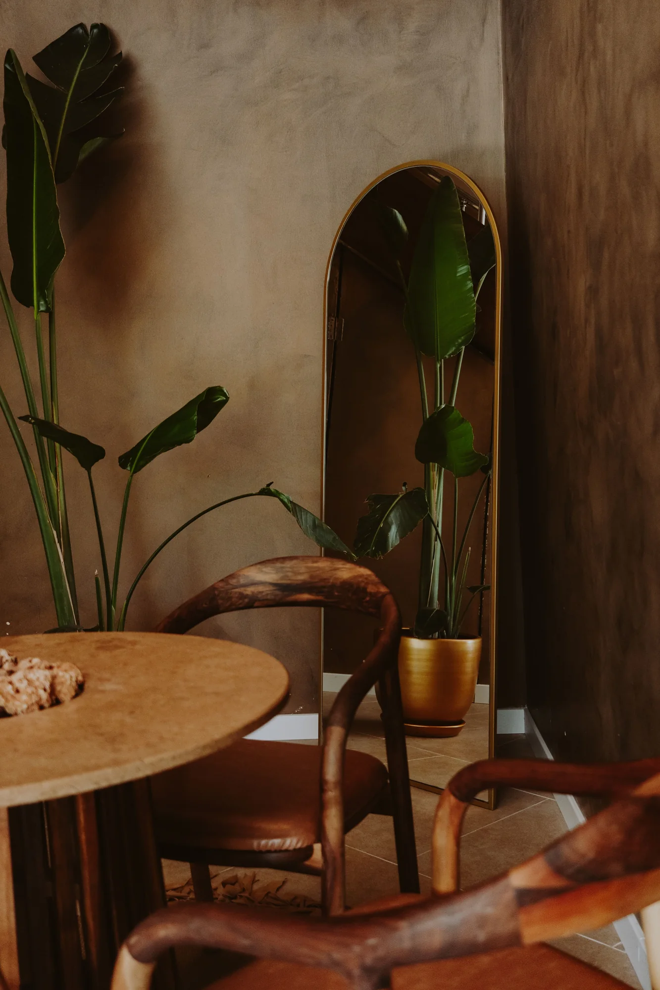 Burnished umber walls in a richly layered interior