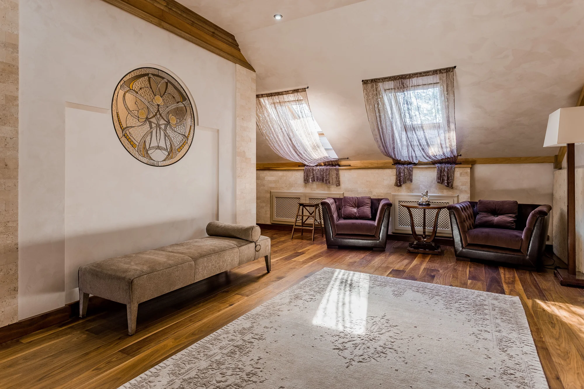 Antique ivory Venetian plaster walls in a refined attic lounge