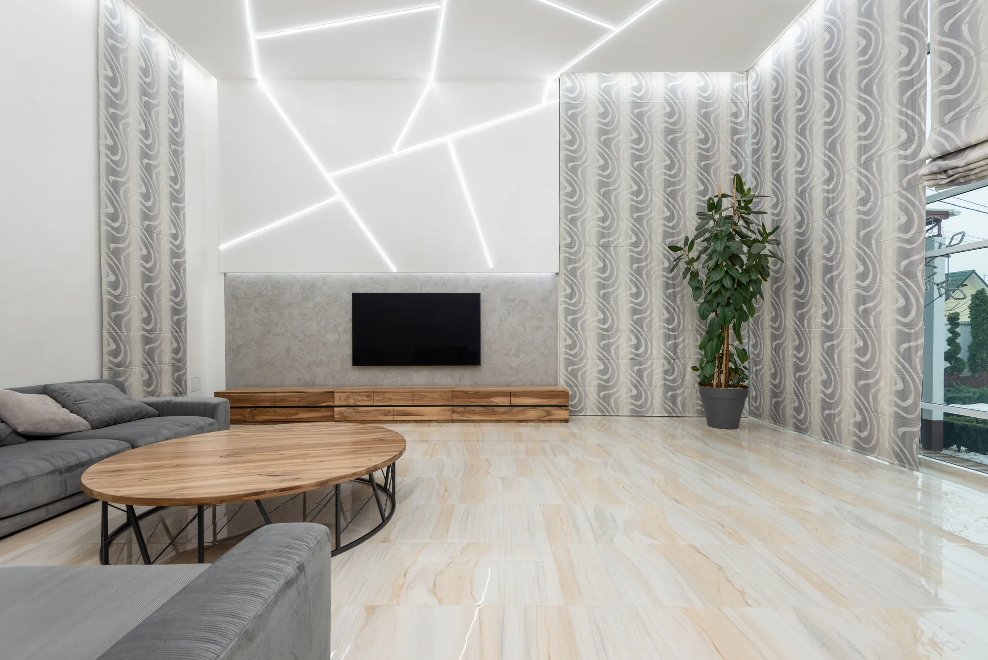 Pearl white plaster feature wall with geometric lighting