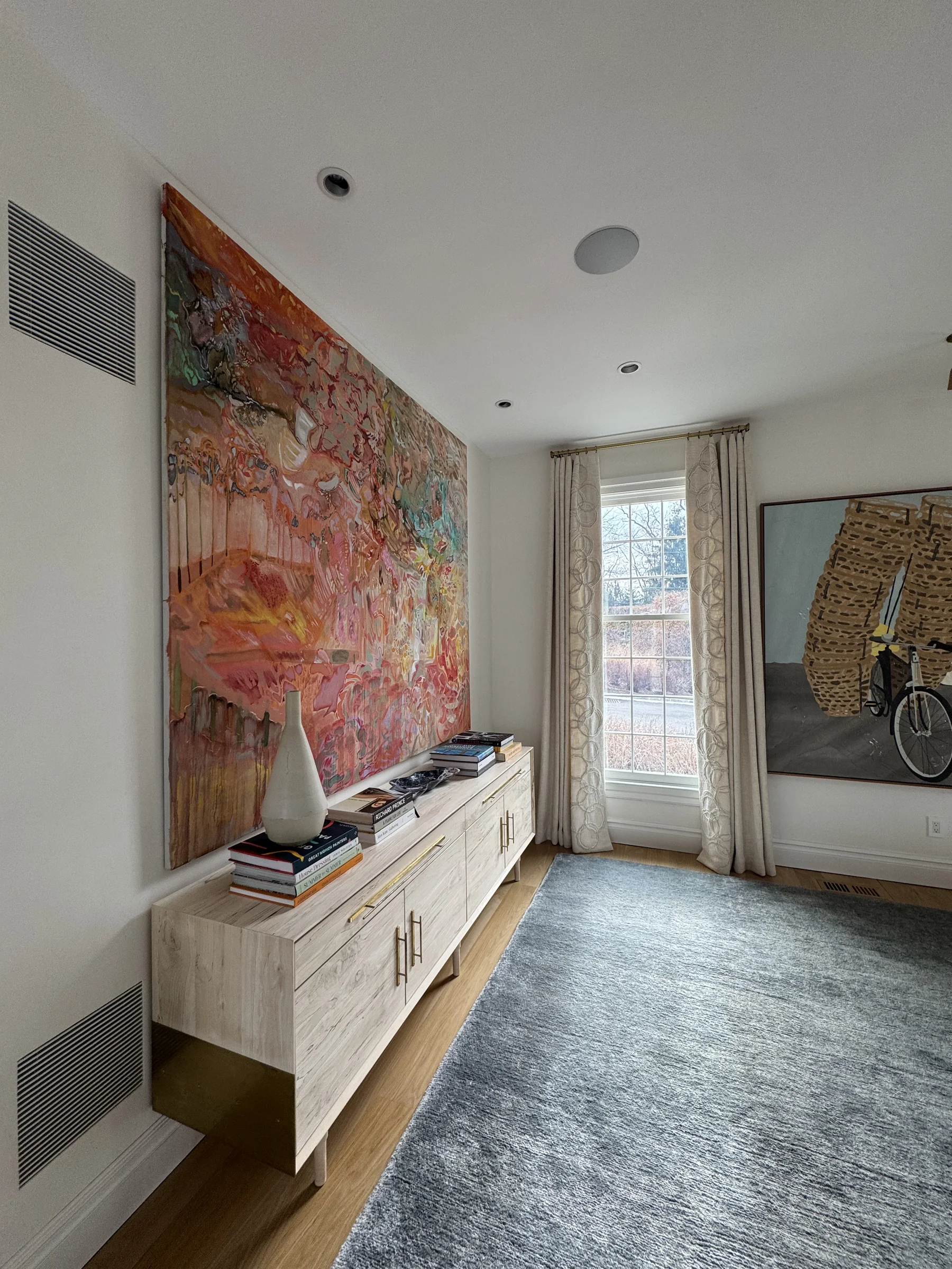 Reflective ceiling surface above a contemporary interior